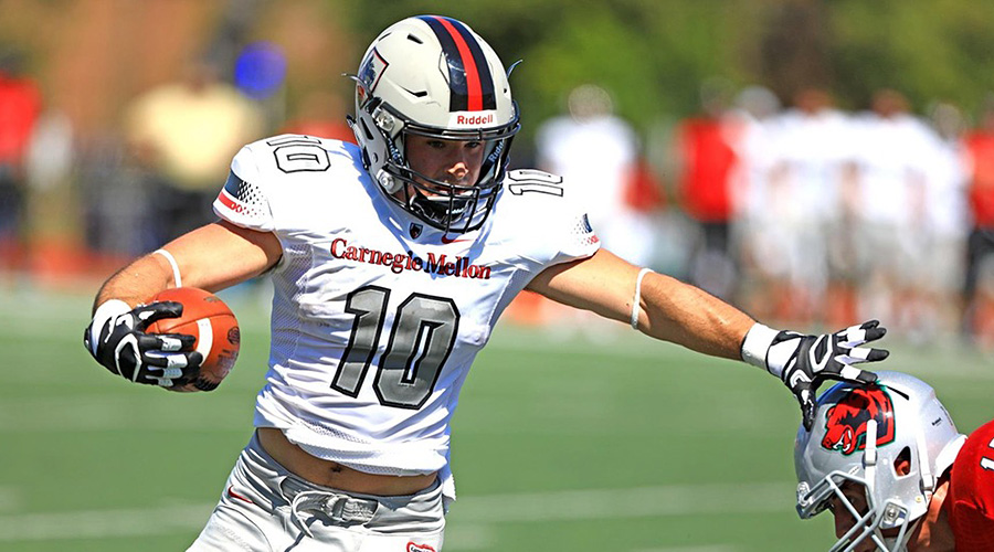 Sam Benger stiff-arms a defender