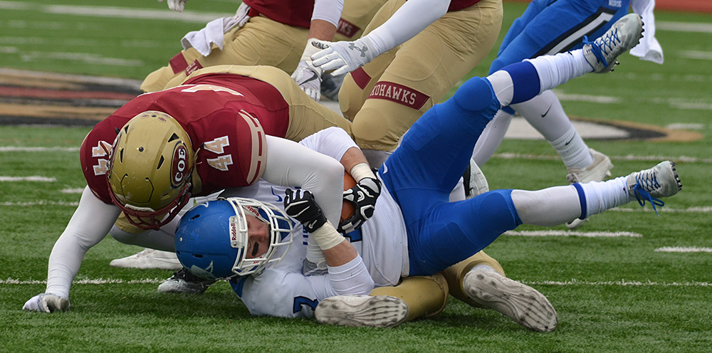 Dalton Shadle tackling a Luther ballcarrier.