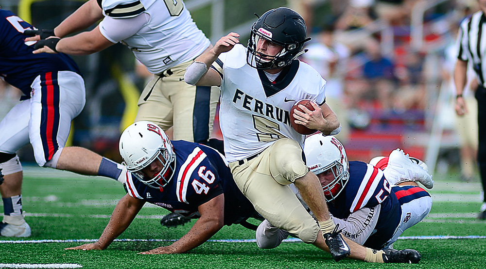 Shenandoah defender bringing down a Ferrum ball-carrier. (Photo by Dan Hunter, d3photography.com)