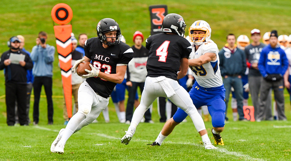 Josh Arndt gets a block from a teammate in attempting to convert a third-and-long. (Martin Luther athletics photo)