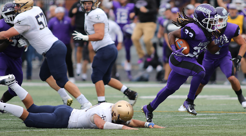 Louis Berry is off to the races after stripping the ball from John Carroll quarterback Anthony Moeglin. (Photo by Dan Poel, Ohiosi.com)