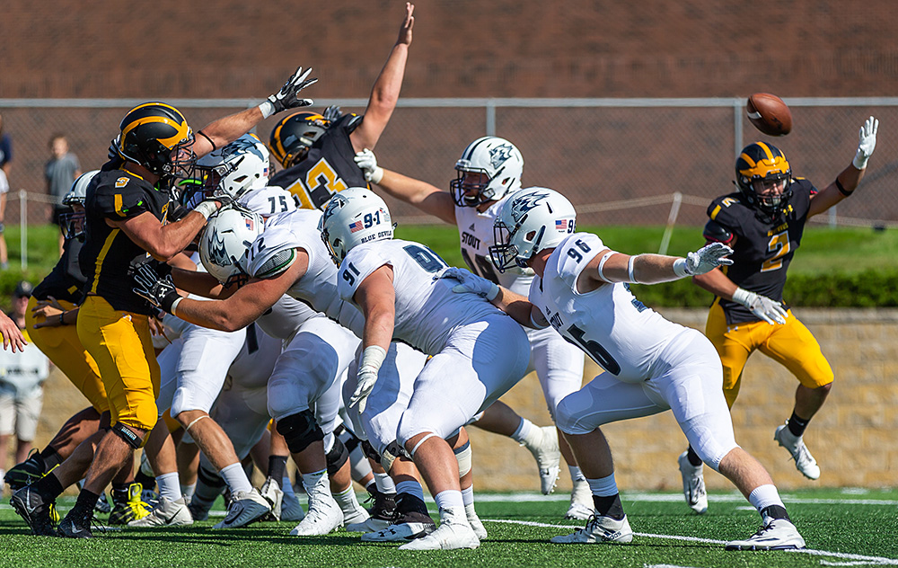 The block photo repeated from above. Photo by Tim Kruse for UW-Stout athletics